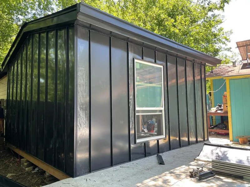 Black standing seam metal wall panels for Roof Inspection in New Orleans