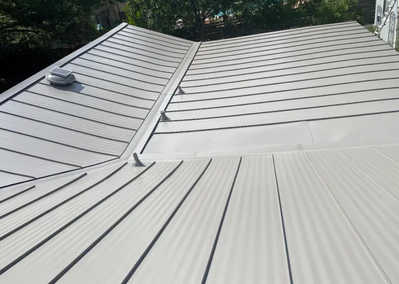 Solar attic fan installed on a metal roof for Roof Ventilation in New Orleans